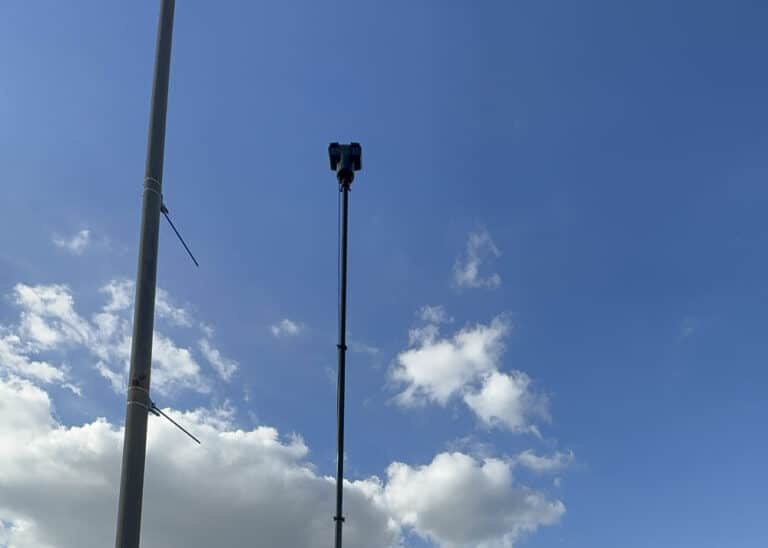 High-mounted camera system on The RATT against a blue sky at the Mid-South Fair.